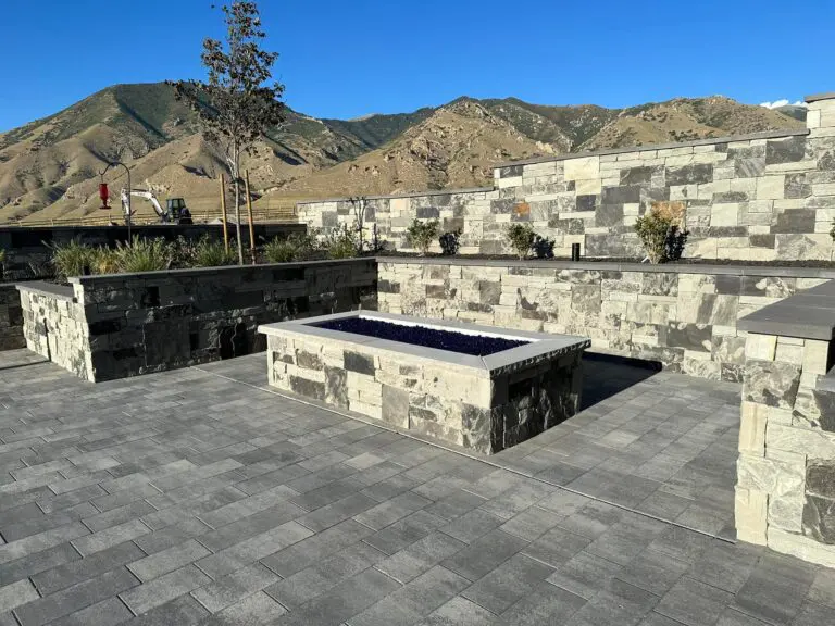 Stone patio with stone walls and raised fire pit Stone Patio with a raised fire pit
