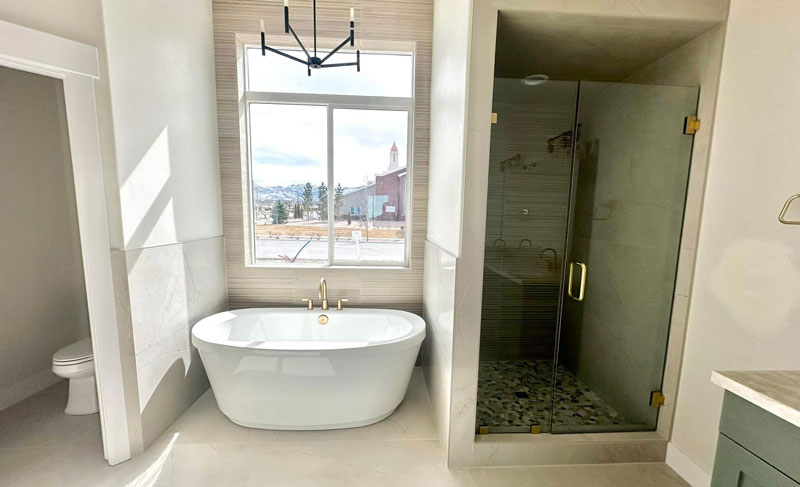 Custom-Shower-&-Tub-istallation Modern bathtub and a walk-in shower done by Latimer Plastering LLC