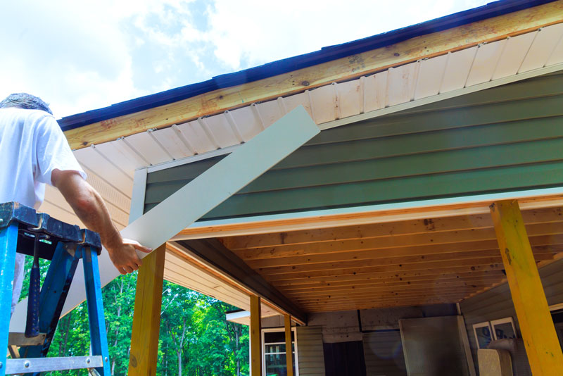 Fascia-Installation Installation of aluminum composite panels fascia trim at exterior wooden corner frames to prevent damage a wood