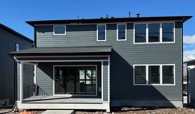 Home exterior 29 Home with siding installed by Latimer Plastering LLC
