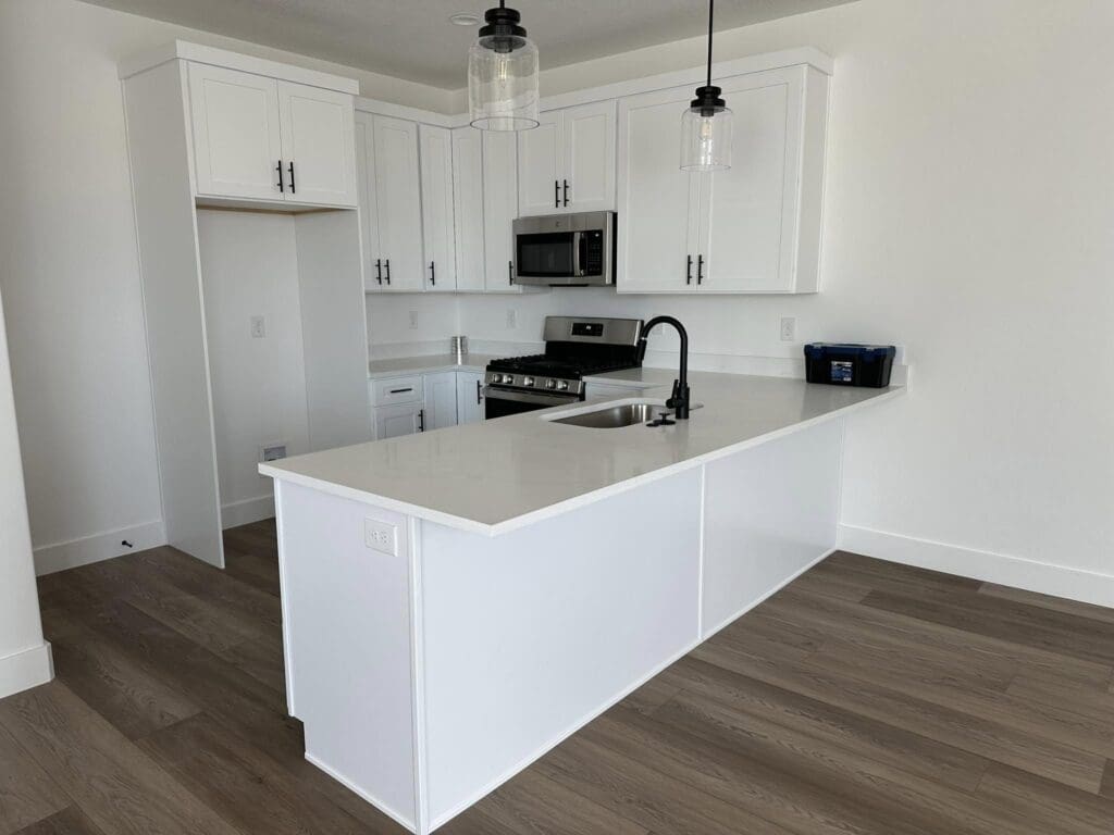 Kitchen 01 Kitchen with white countertops and cabinets with modern lighting