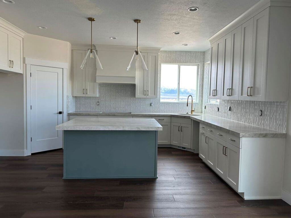 Kitchen-Remodeling Newly remodeled kitchen with white countertops, and wood floors