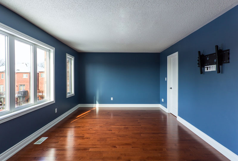 Freshly painted, newly renovated second floor room of a house. 
