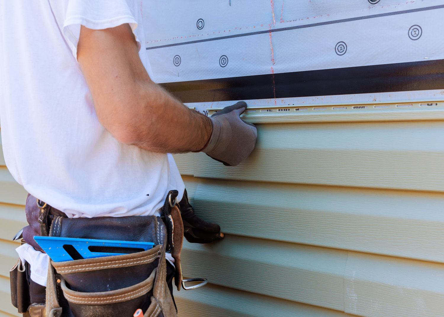 Siding-Installation Man installing siding