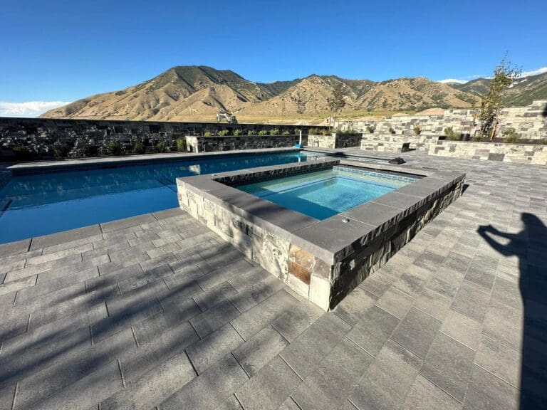 pool and jacuzzi with stone around